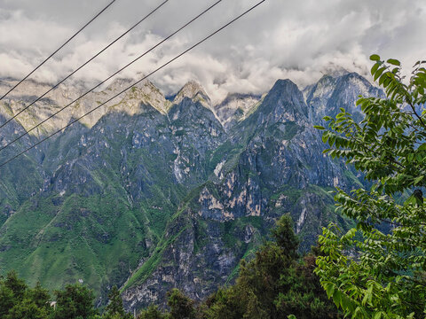 Mountain landscape with misty peaks and green forest in China