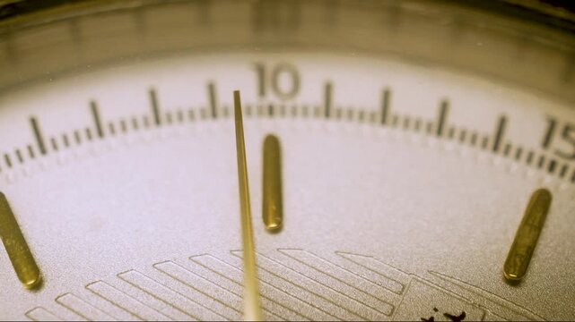 wristwatch dial with ticking second hand, macro shot