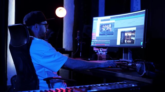 Audio Engineer Editing Music Project In Modern Studio