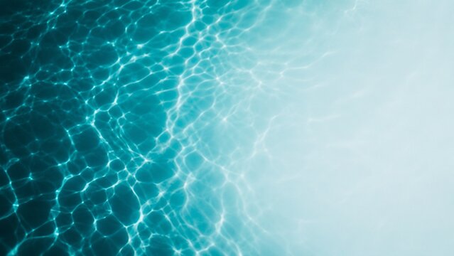 Deep teal water reflection fading into pale blue