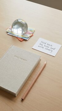 Journal and Pencil on a Wooden Desk for Digital Detox and Mindfulness