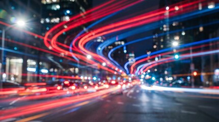 Fototapeta premium Dynamic Red and Blue Light Trails on Busy City Street at Night