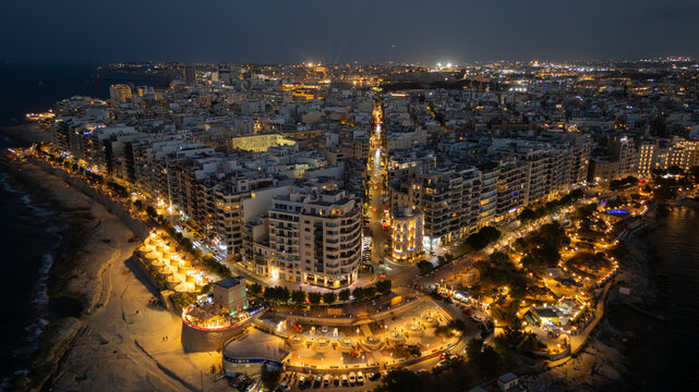 Aerial view of Sliema and St Julian's Bay waterfront lights at night, Malta