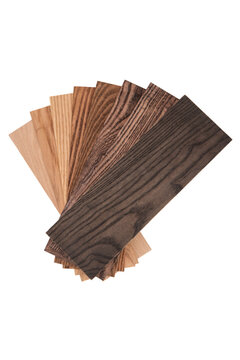 Fan-shaped wood color swatches and veneer samples isolated on white background.