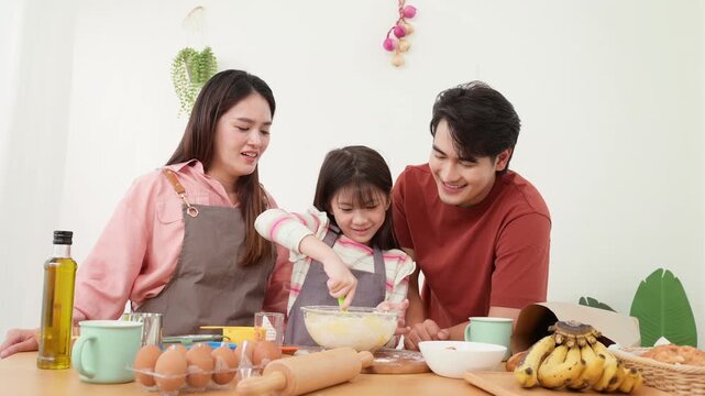 Family Enjoys Baking Together in the Kitchen While Making Cookies