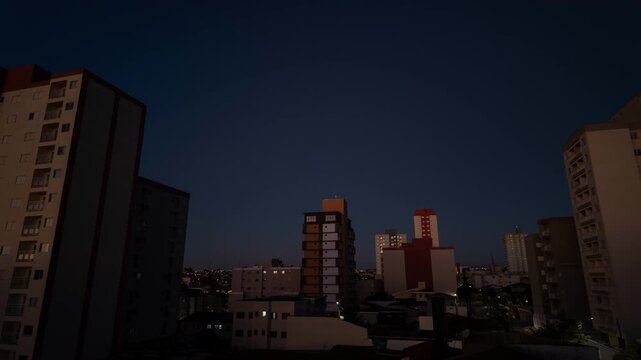 Timelapse of S&atilde;o Carlos Tower at Quiet Urban Dusk