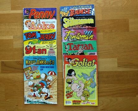 A pile of comic books. Donald Duck, Tom and Jerry, The Phantom, Superman, Tarzan and more. Swedish text. From the 1980 and 1990s.