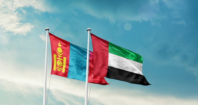 Mongolia and UAE friendship flags are waving in the sky. Double country Flag waving with mast. Mongolia UAE national flag for agreement.