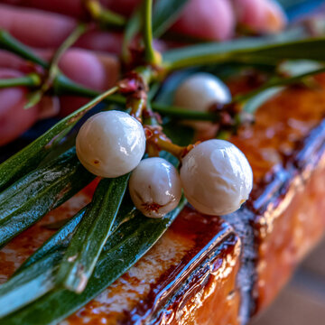 Extreme close up of white berries on a branch with green leaves botanical seasonal perennial