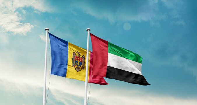 Moldova and UAE friendship flags are waving in the sky. Double country Flag waving with mast. Moldova UAE national flag for agreement.