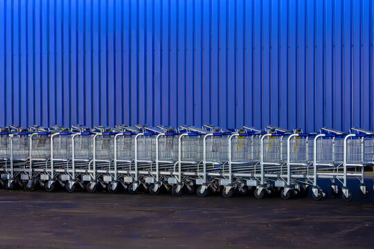 Shopping carts in front of supermarket wall