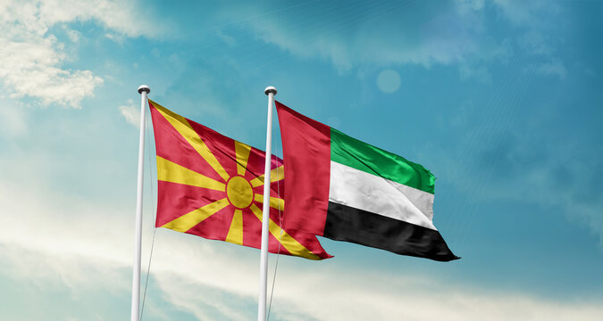 North Macedonia and UAE friendship flags are waving in the sky. Double country Flag waving with mast. North Macedonia UAE national flag for agreement.