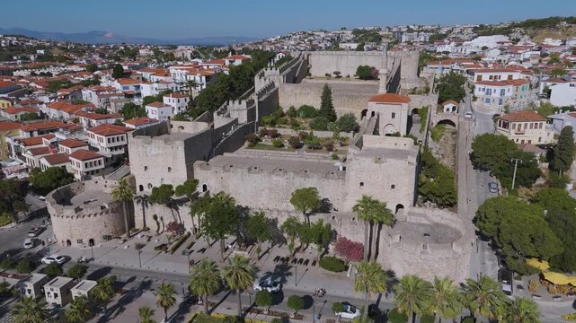 Aerial footage of Cesme Castle, and town centre of Cesme, Turkey. &Ccedil;eşme is a seaside resort town and district on the tip of the Urla-Karaburun-&Ccedil;eşme Peninsula in Turkey's Aegean Region.