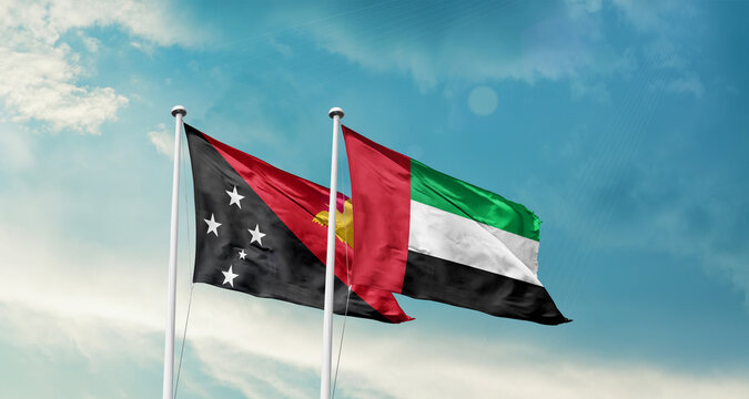 Papua New Guinea and UAE friendship flags are waving in the sky. Double country Flag waving with mast. Papua New Guinea UAE national flag for agreement.