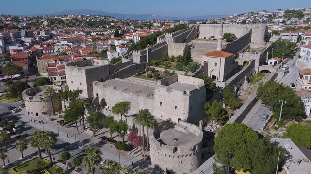 Aerial footage of Cesme Castle, and town centre of Cesme, Turkey. &Ccedil;eşme is a seaside resort town and district on the tip of the Urla-Karaburun-&Ccedil;eşme Peninsula in Turkey's Aegean Region.