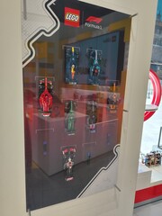 Fototapeta premium LEGO Formula 1 Racing Cars Display Stand with Miniature Speed Champions Models on Board in Store. Milan, Italy - June 24, 2026