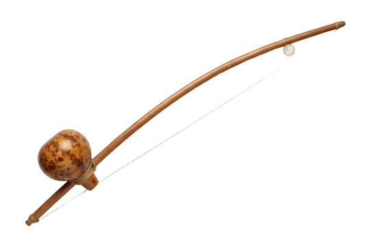 Brazilian berimbau musical bow on black background.