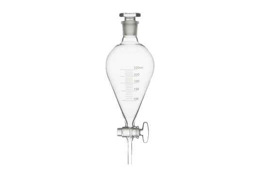 Laboratory glass separatory funnel on black background.