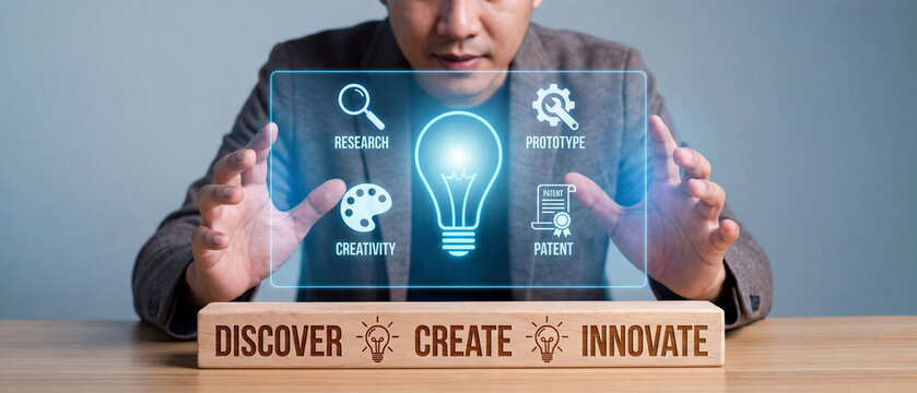 Businessman interacting with a virtual interface showing innovation process steps including research, creativity, prototype, and patent