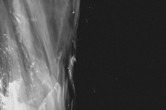 light leak overlay effect with scratch dust and blur light leaks,retro noisy film texture light leak flare on black background,abstract black and white background with red bokeh,grunge film strip