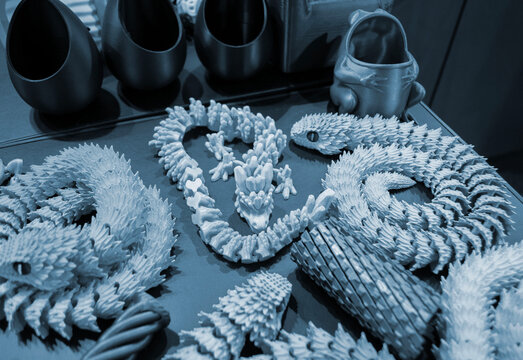 Art models printed on 3D printer. Different objects created on 3D printer from molten plastic. 3D printed different objects. Modern new modern additive progressive technologies. 3D printing technology