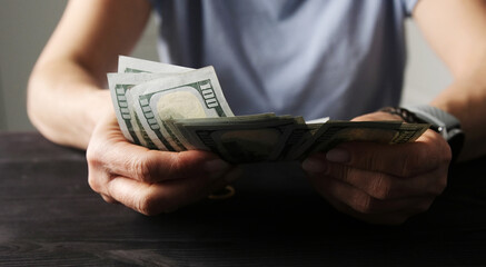 Lady Calculating Her Money Savings In Us Dollar Bills © Ievgen Skrypko