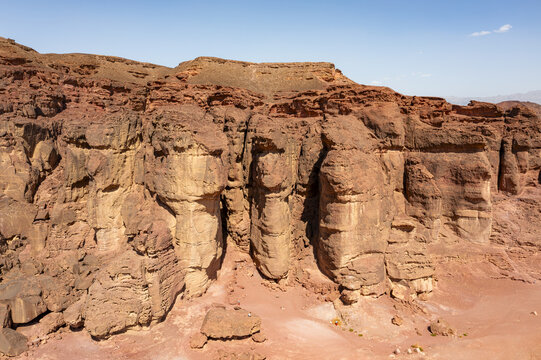Aerial view of the dramatic red sandstone cliffs and rugged desert landscape of Timna Park in Eilat, South District, Israel.