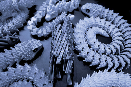 Art models printed on 3D printer. Different objects created on 3D printer from molten plastic. 3D printed different objects. Modern new modern additive progressive technologies. 3D printing technology
