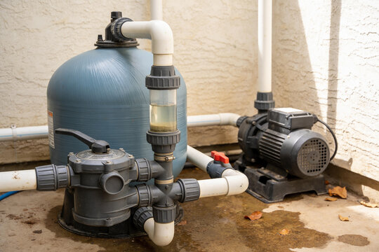 Pool pump and filter system with plumbing and clear water trap