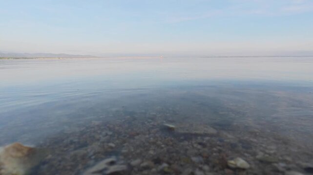 Calm Waters of a Lake at Sunrise