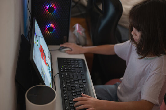 Child playing game on PC