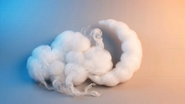 Soft white cotton clouds gradually shift in shape against a gradient background of blue and orange, creating a whimsical and dreamy atmosphere