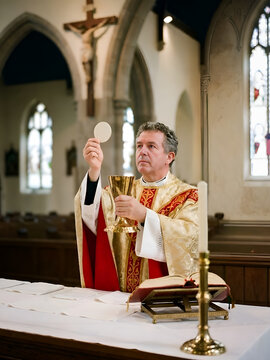 Priest leading religious ceremony in church