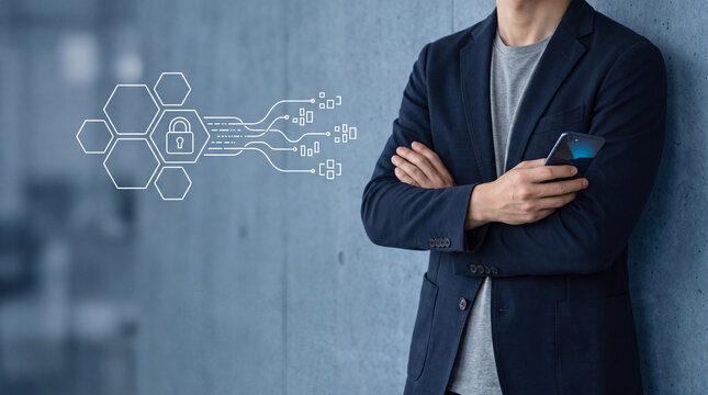 Businessman using smartphone for cybersecurity. Professional managing digital data protection.