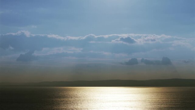 4K Turning into Sunset on Cloudy Sky Over Lake 