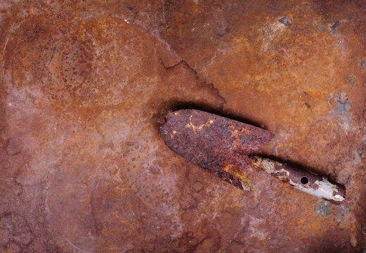 rust and oxidized metal surface background. and rusty small shovel,Grunge style