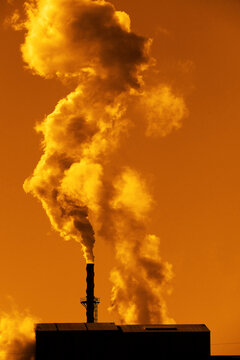 Factory or Energy Plant with Smoke Stacks Spewing Pollution and Pollutants Into the Air Dangerous Emissions for Environment