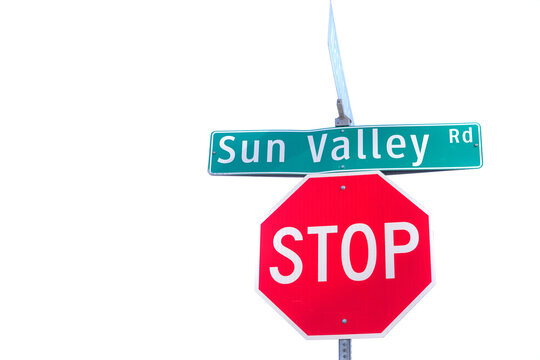 Bright Red Stop Sigh on Sun Valley Road in Resort Town in Idaho with Sky in Background