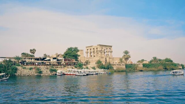 video from sailboat sailing on nile river of The ancient and historical Philae Temples complex in Aswan. it built to worship the goddess "Isis" - Egypt.
