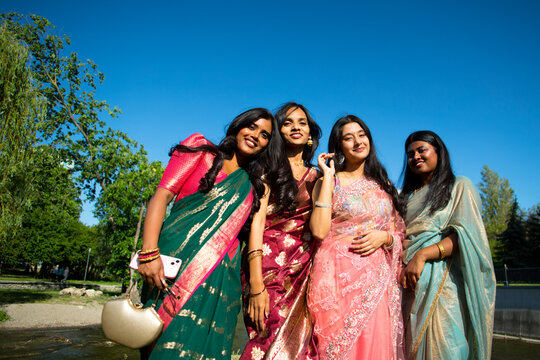 Group portrait of Indian women in traditional clothes.
