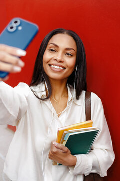 Woman Snapping Selfie with Red and Blue Accents