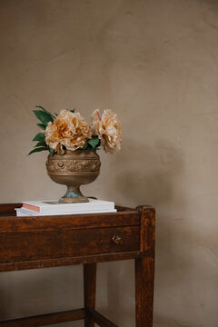 A vintage brass vase of flowers still life