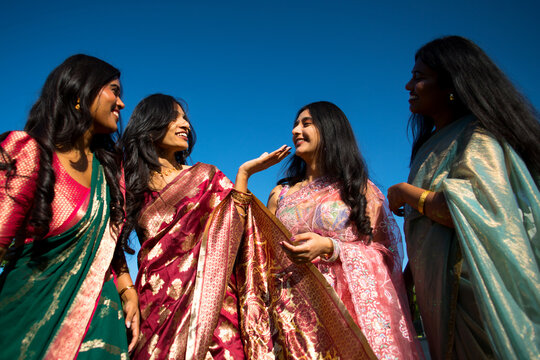 Group portrait of Indian women in traditional clothes.
