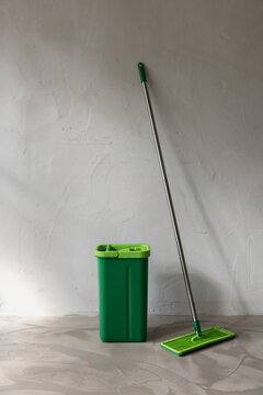 Cleaning mop and bucket still life