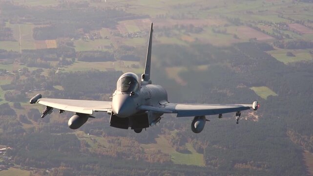 Eurofighter Typhoon Demonstrates High-Speed Air Superiority Mission Above Scenic Landscape with Exceptional Precision and Tactical Readiness.