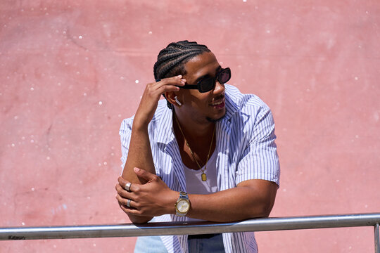 Young man enjoying summer with urban style