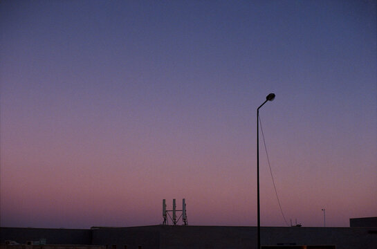 Lamp Post Over Rooftop