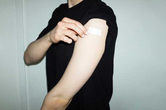 Conceptual image of person has taken the vaccination & having plaster