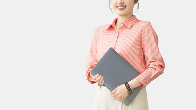 ノートパソコンを持つ女性・ビジネスウーマン, Businesswoman Holding a Laptop Computer