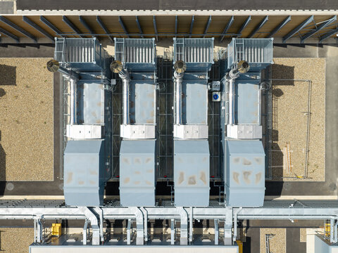 Aerial view of industrial cooling units and power generators at a data center facility in the United Kingdom.